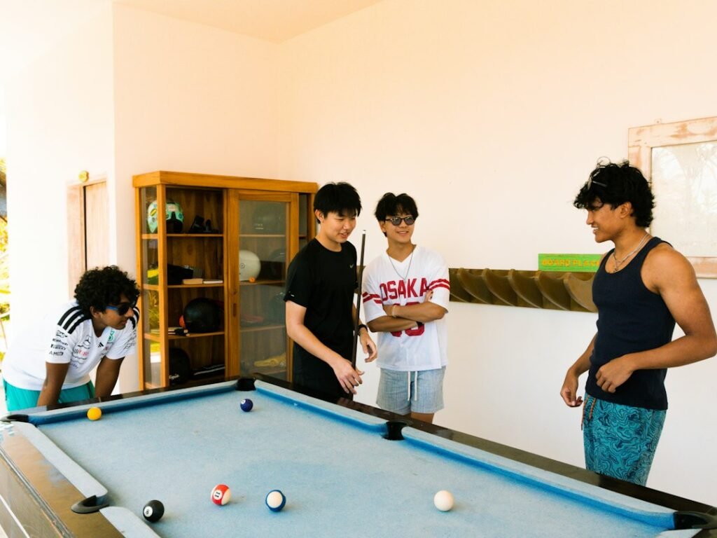 Friends playing an indoor group game in a small room