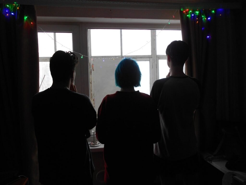 Friends looking at celebration lights during a New Year's Eve party